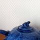 Blue ceramic Art Deco teapot with a frog.