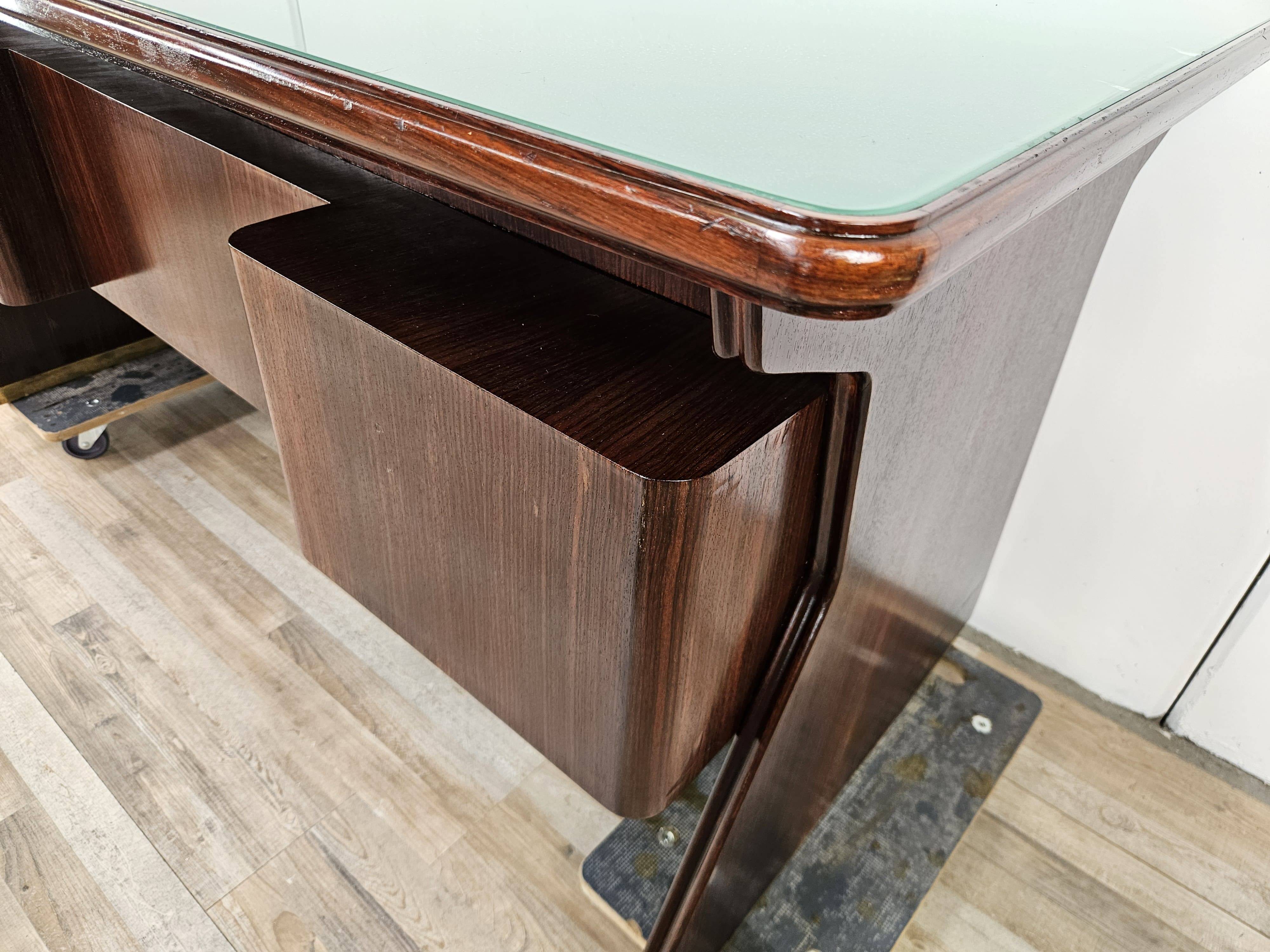 Executive Art Decò desk in exotic wood, glass, and brass