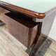 Art Deco executive desk in exotic wood, glass, and brass.