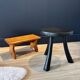 Small black wooden tripod stool
