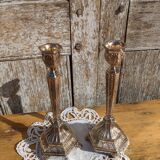 Pair of chiseled metal candle holders