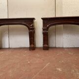 Pair of Louis XIV style fireplaces in red cherry marble. XIX century.