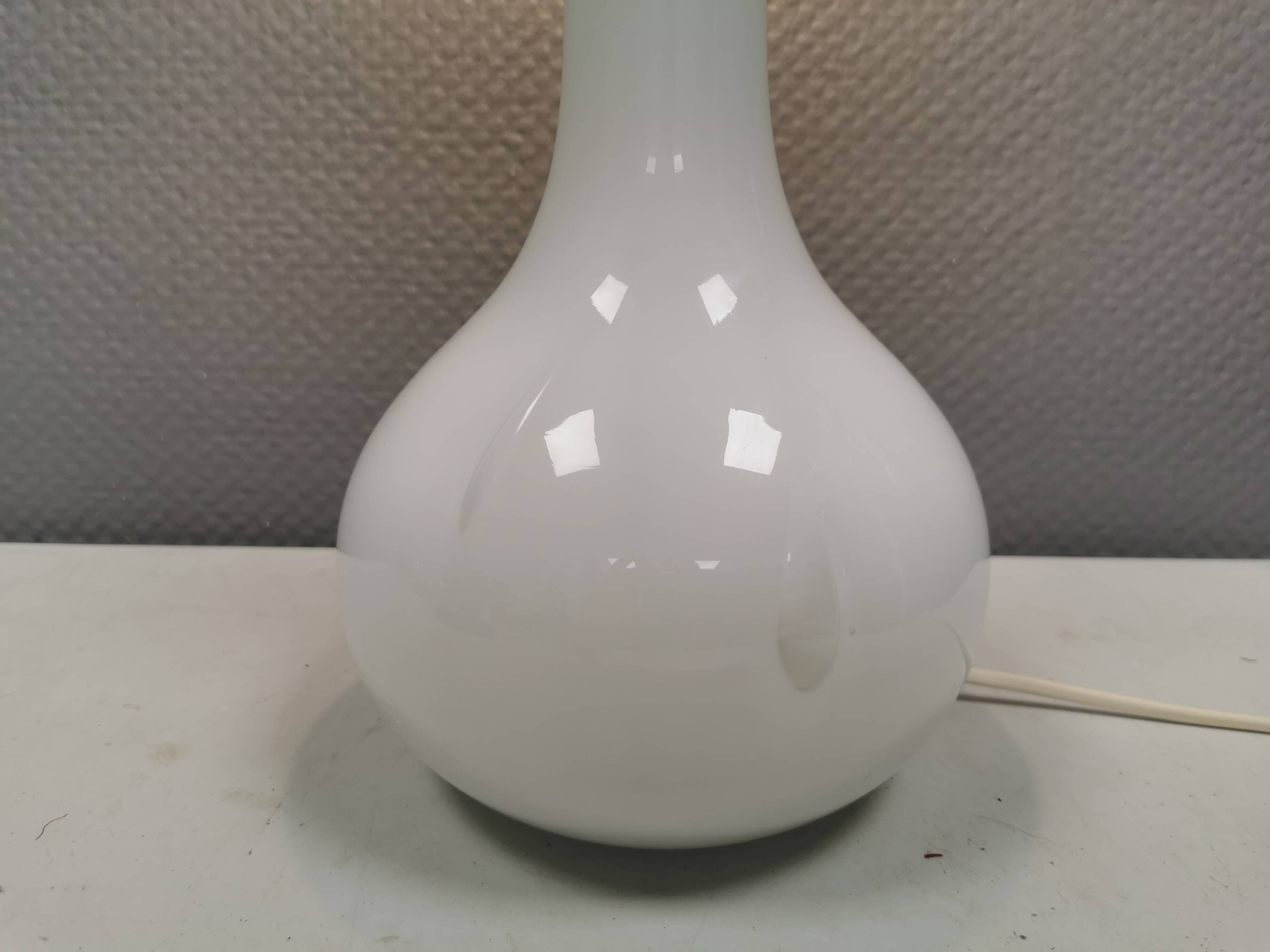 Helios table lamp, teardrop shaped, made of white opal glass. 1986 Denmark