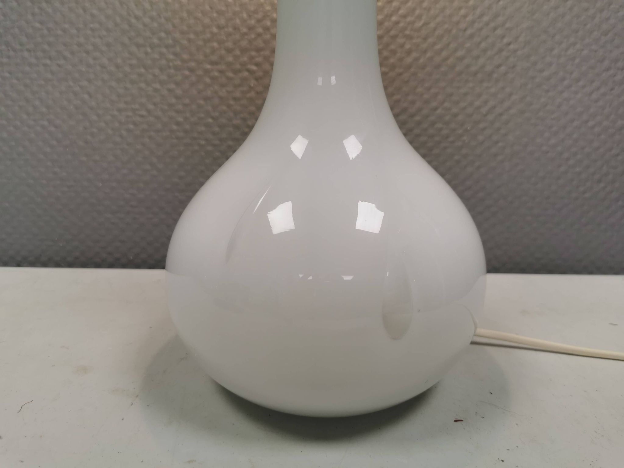 Helios table lamp, teardrop shaped, made of white opal glass. 1986 Denmark