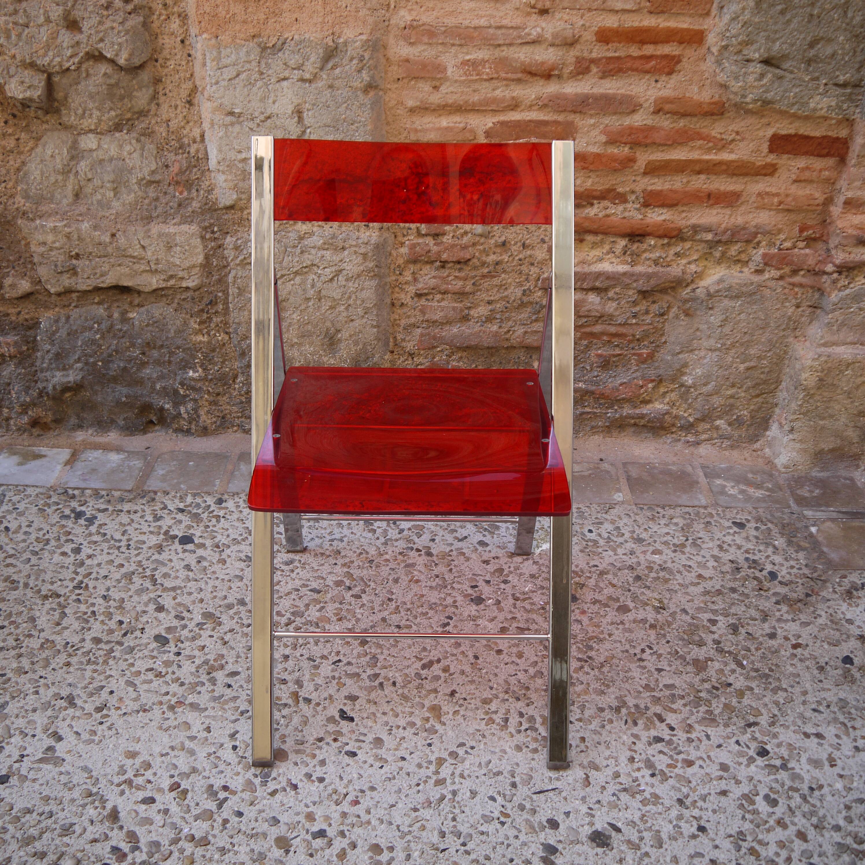 Red Plexiglas folding chair