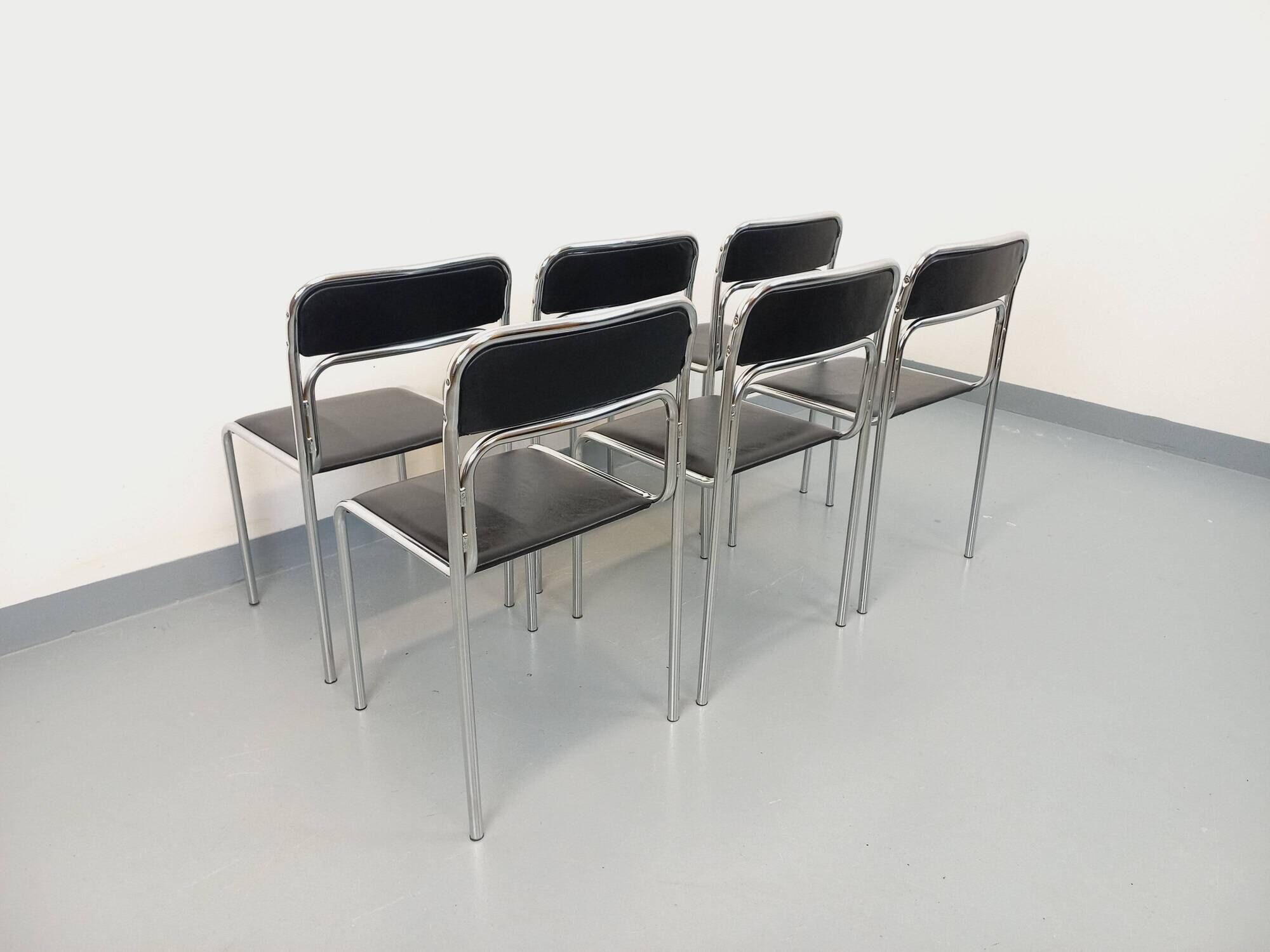 Set of 6 vintage Italian stackable chairs in chrome metal and faux leather.