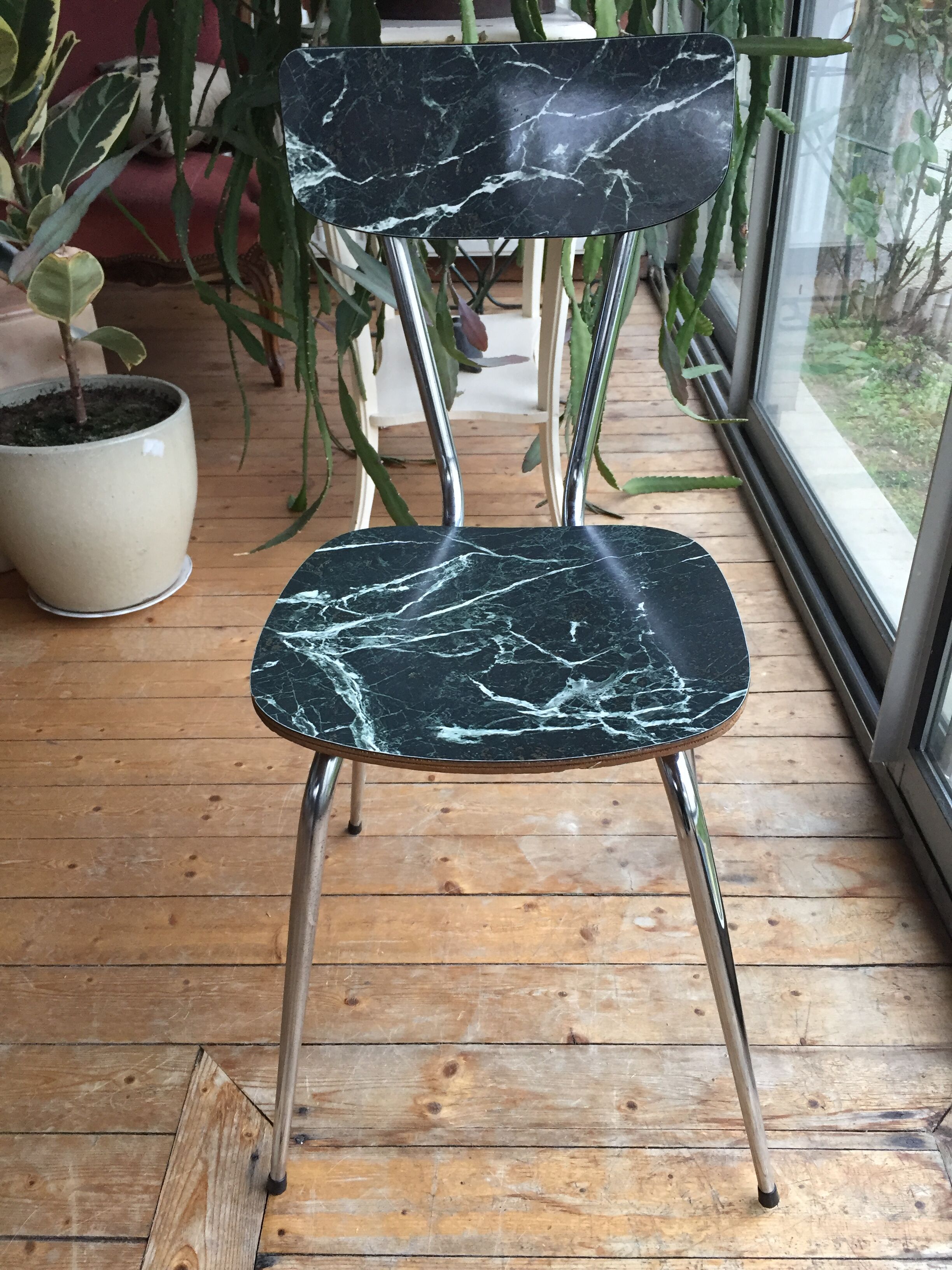4 chairs in very dark green formica marble effect