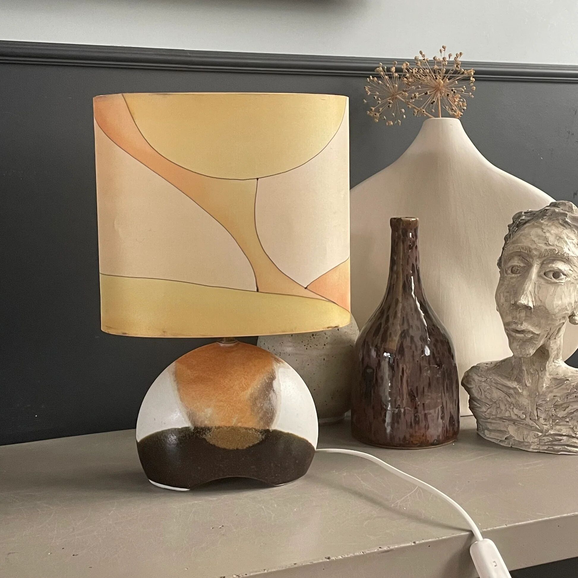 Ceramic floor lamp with a silk shade, signed.