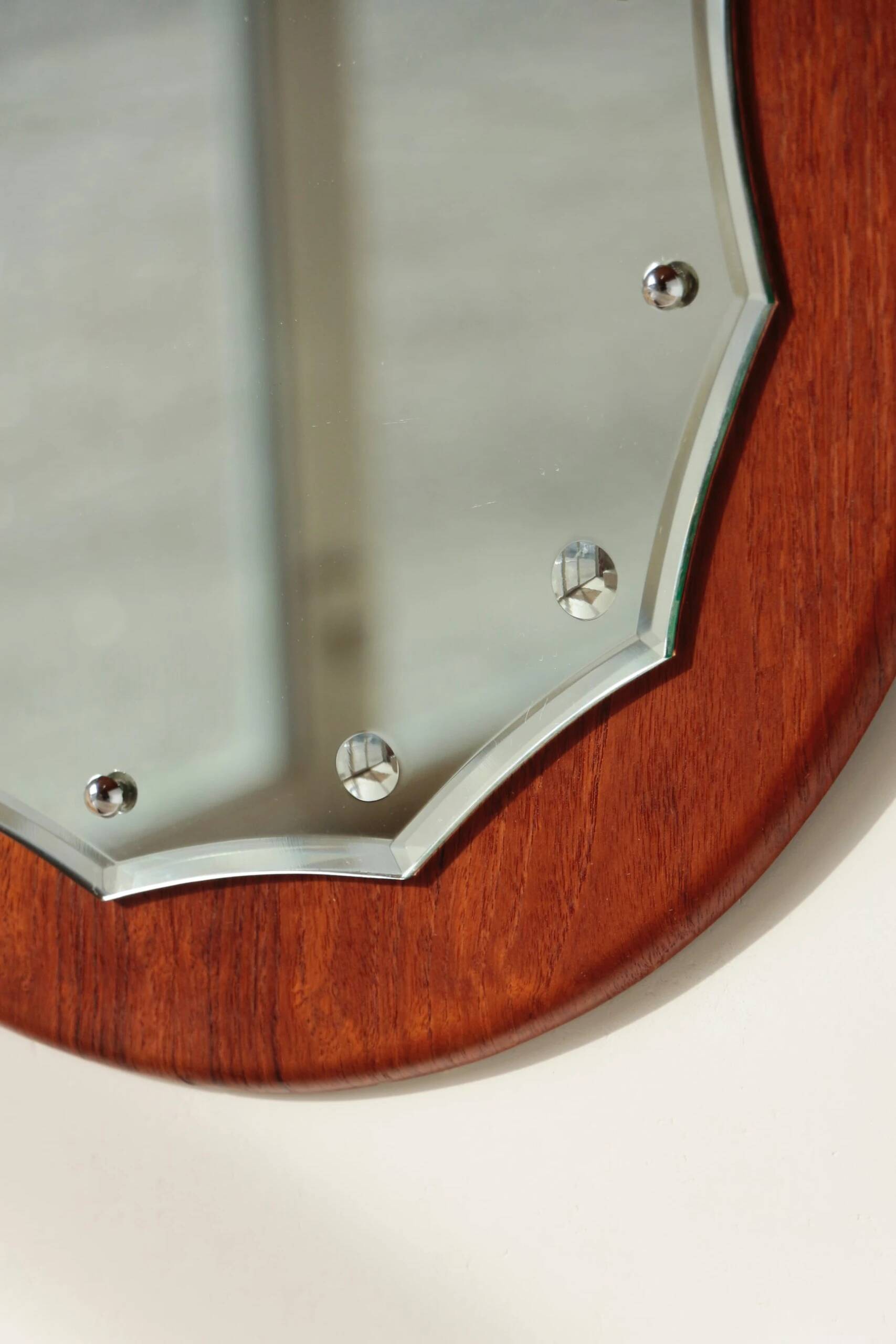 Vintage round teak mirror from the 1960s.
