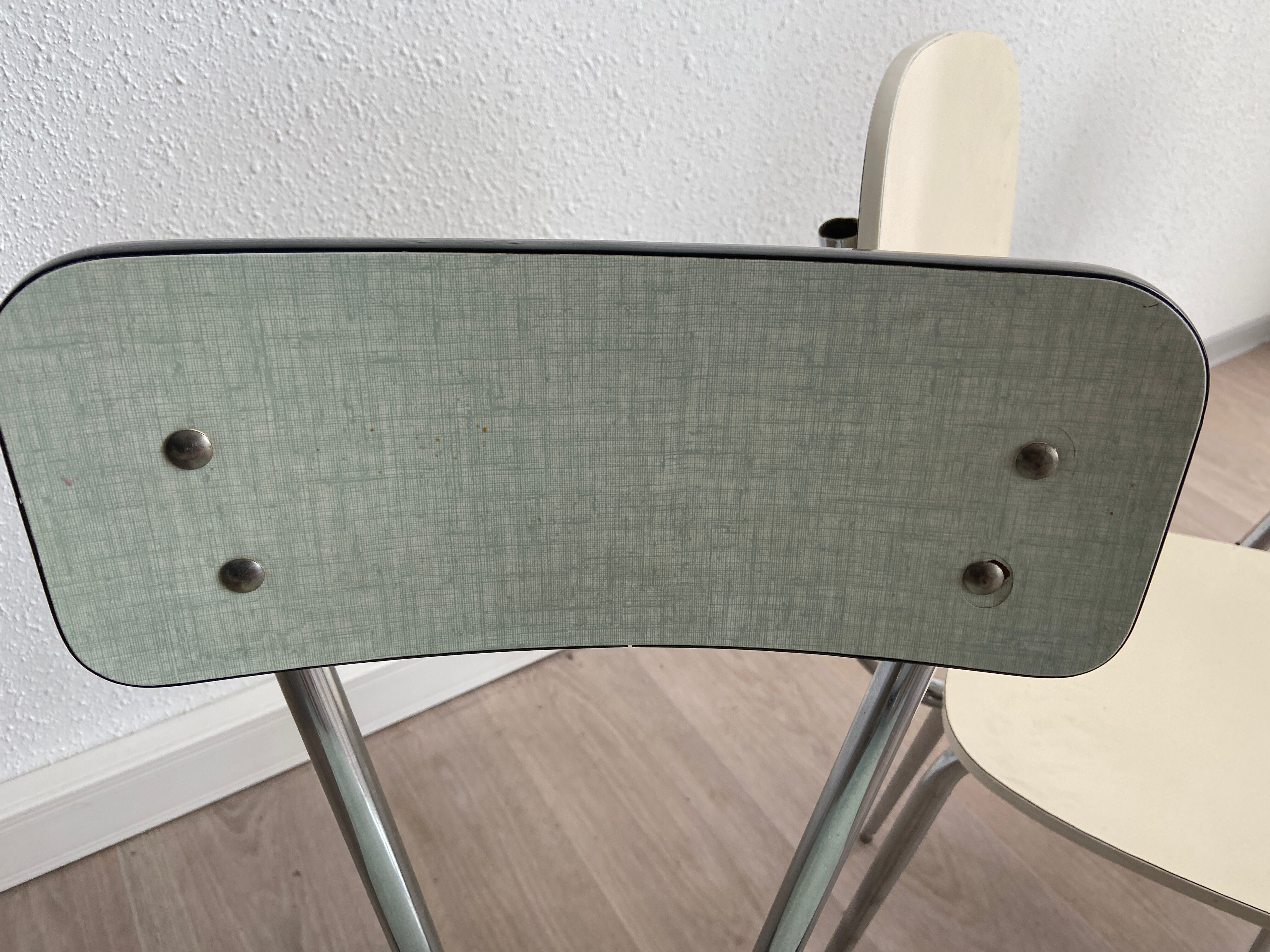 10 mismatched multicolored Formica chairs 60s