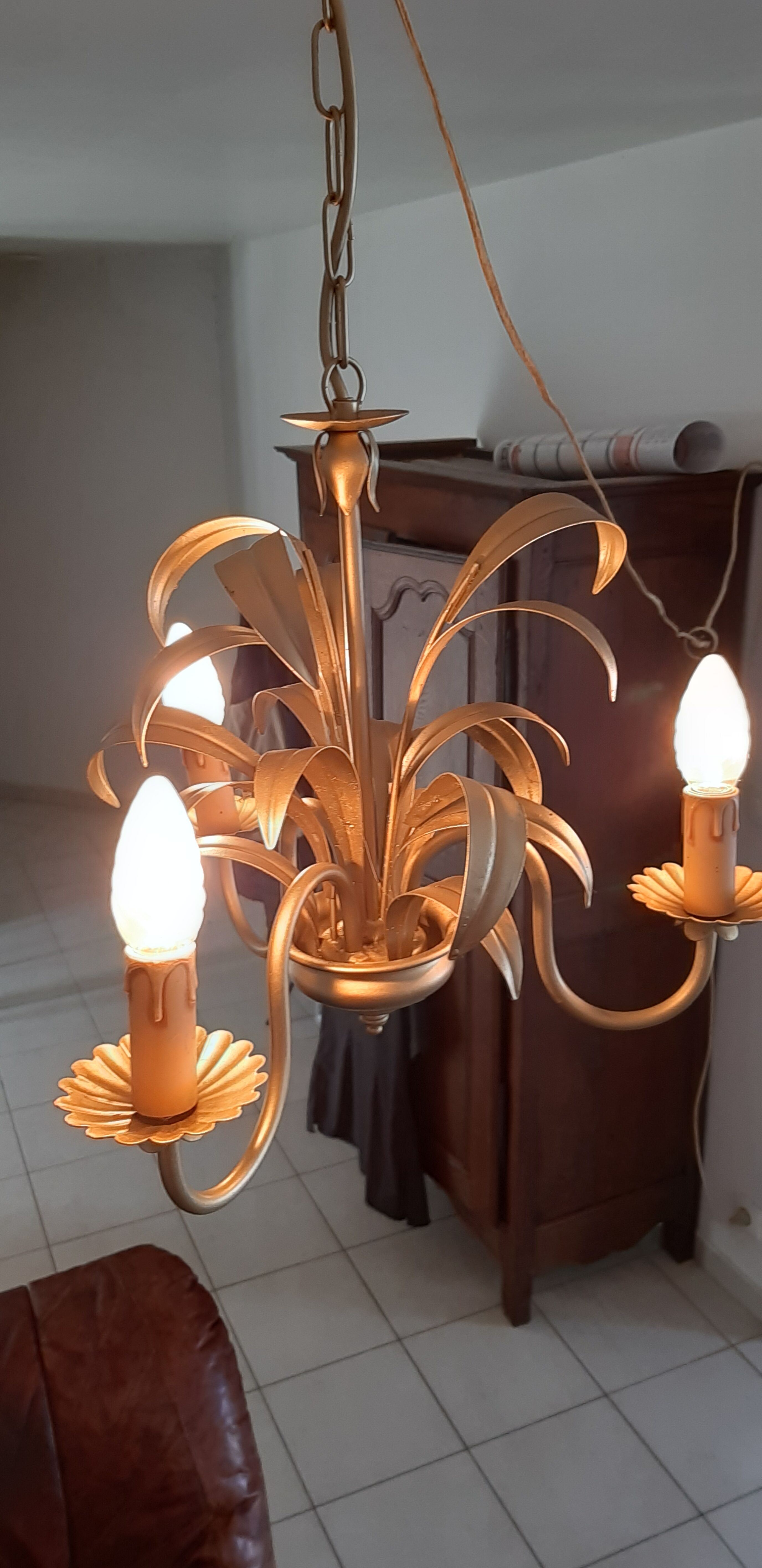 Vintage chandelier in golden metal