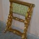 Folding stool with X-frame, carved golden wood, 19th century.