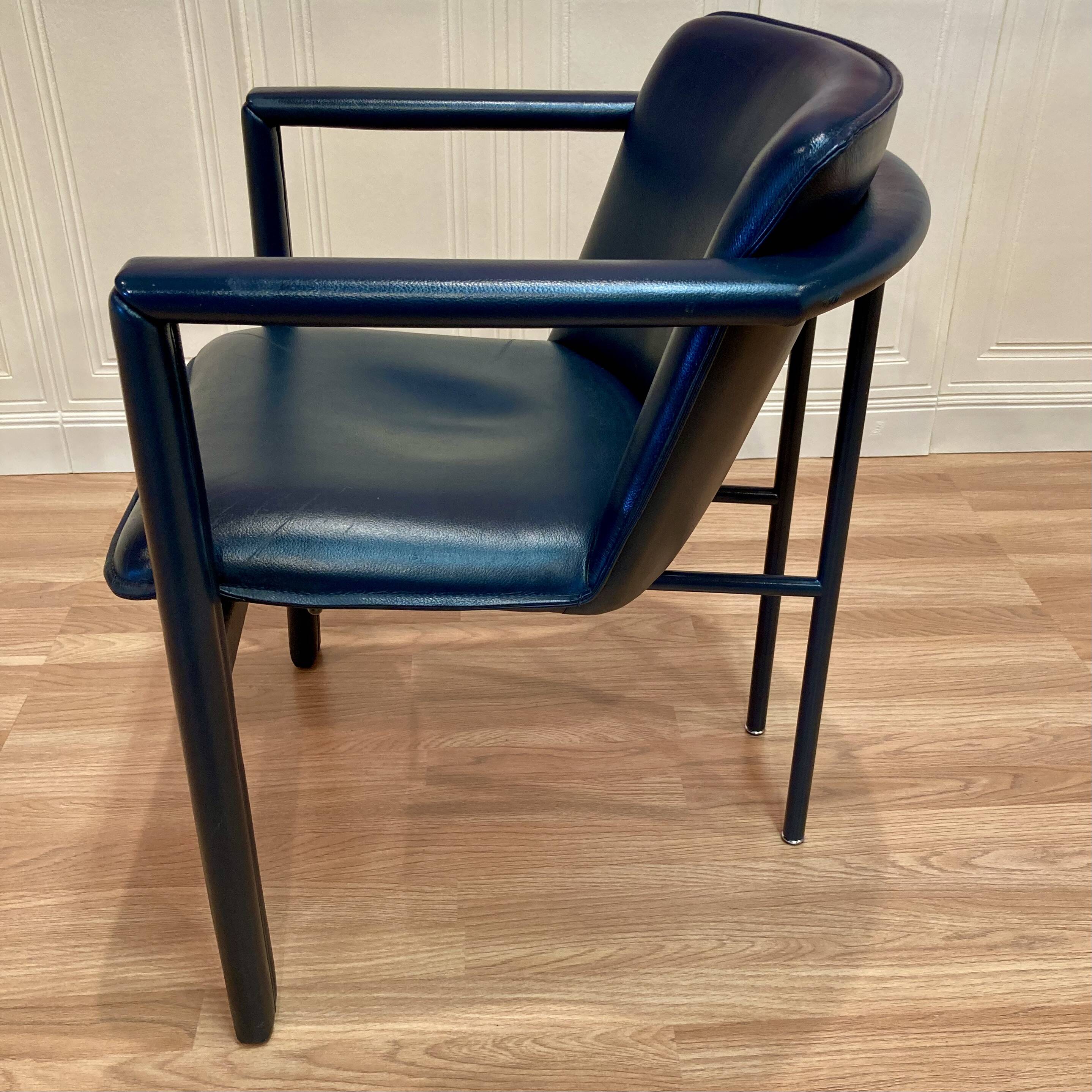 Set of 3 designer leather and metal armchairs.