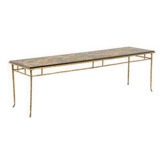Maison Baguès. Coffee table in bronze, black lacquer, gold decoration. Circa 1970.
