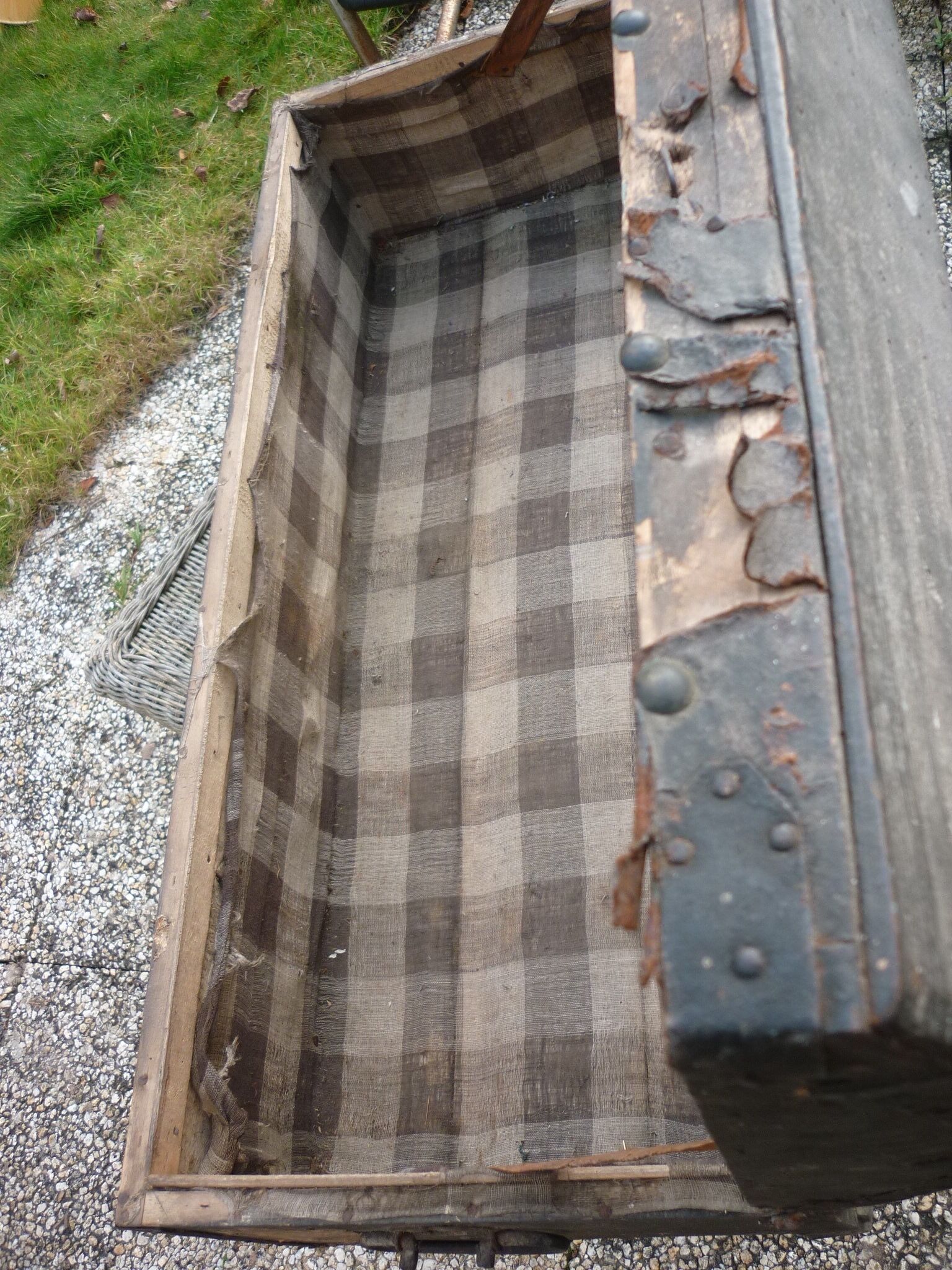 Old bulging wooden travel trunk