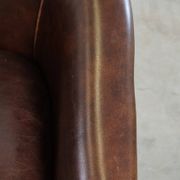 luxury dark leather club chair with English-style ball feet