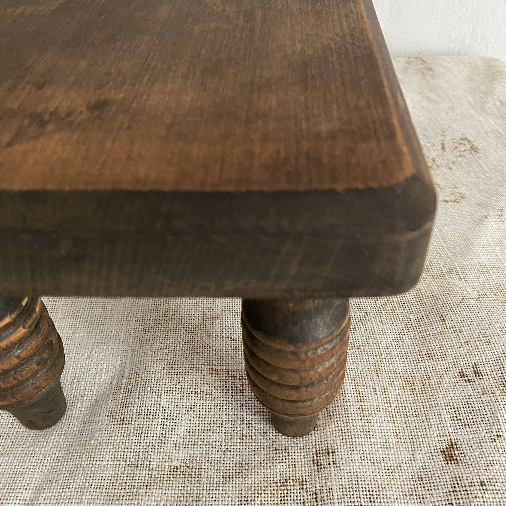 Low stool, turned wooden legs.
