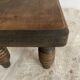 Low stool, turned wooden legs.