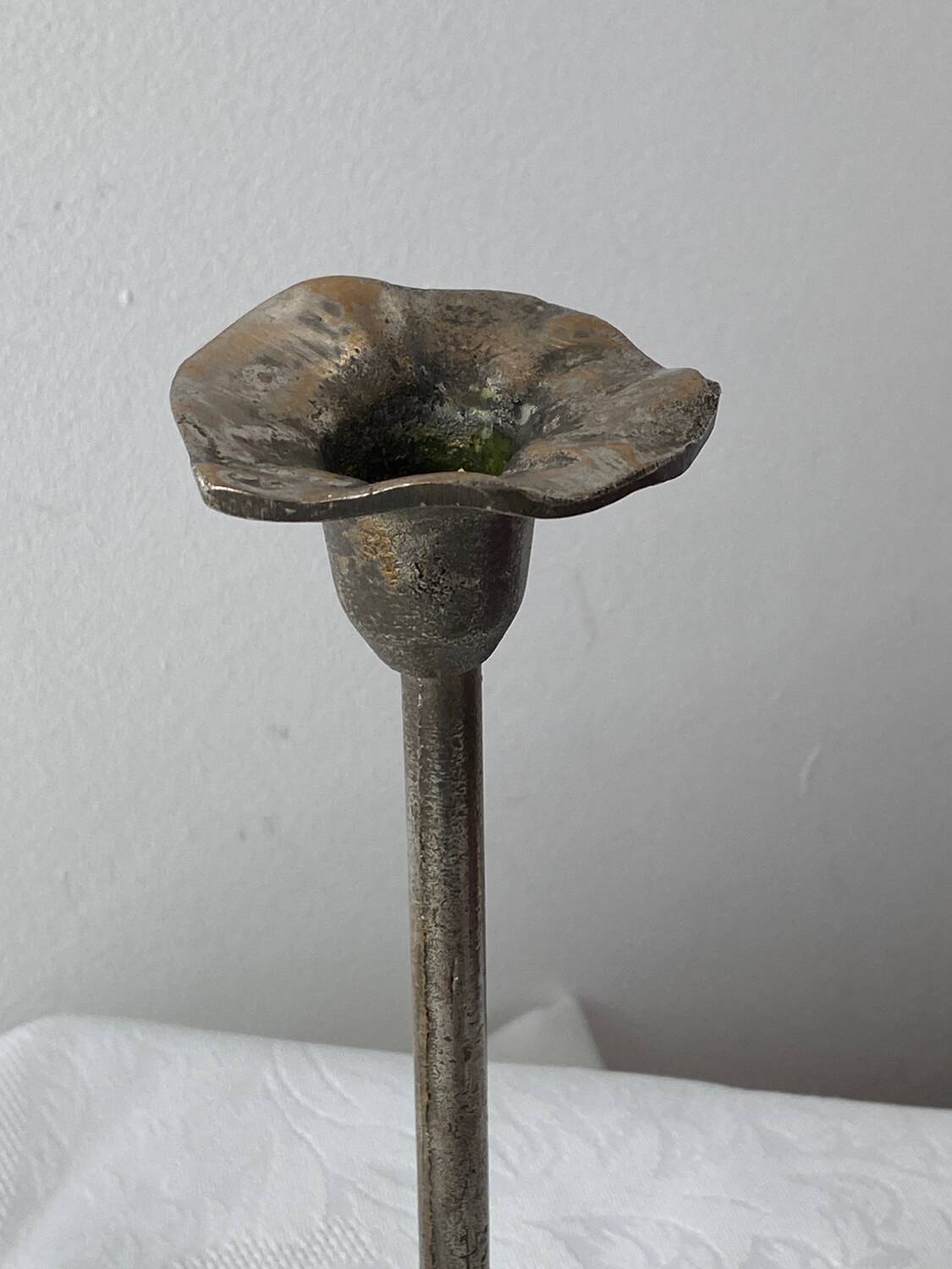 Pair of metal flower candlesticks