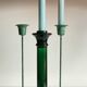 Green glass and metal candle holders