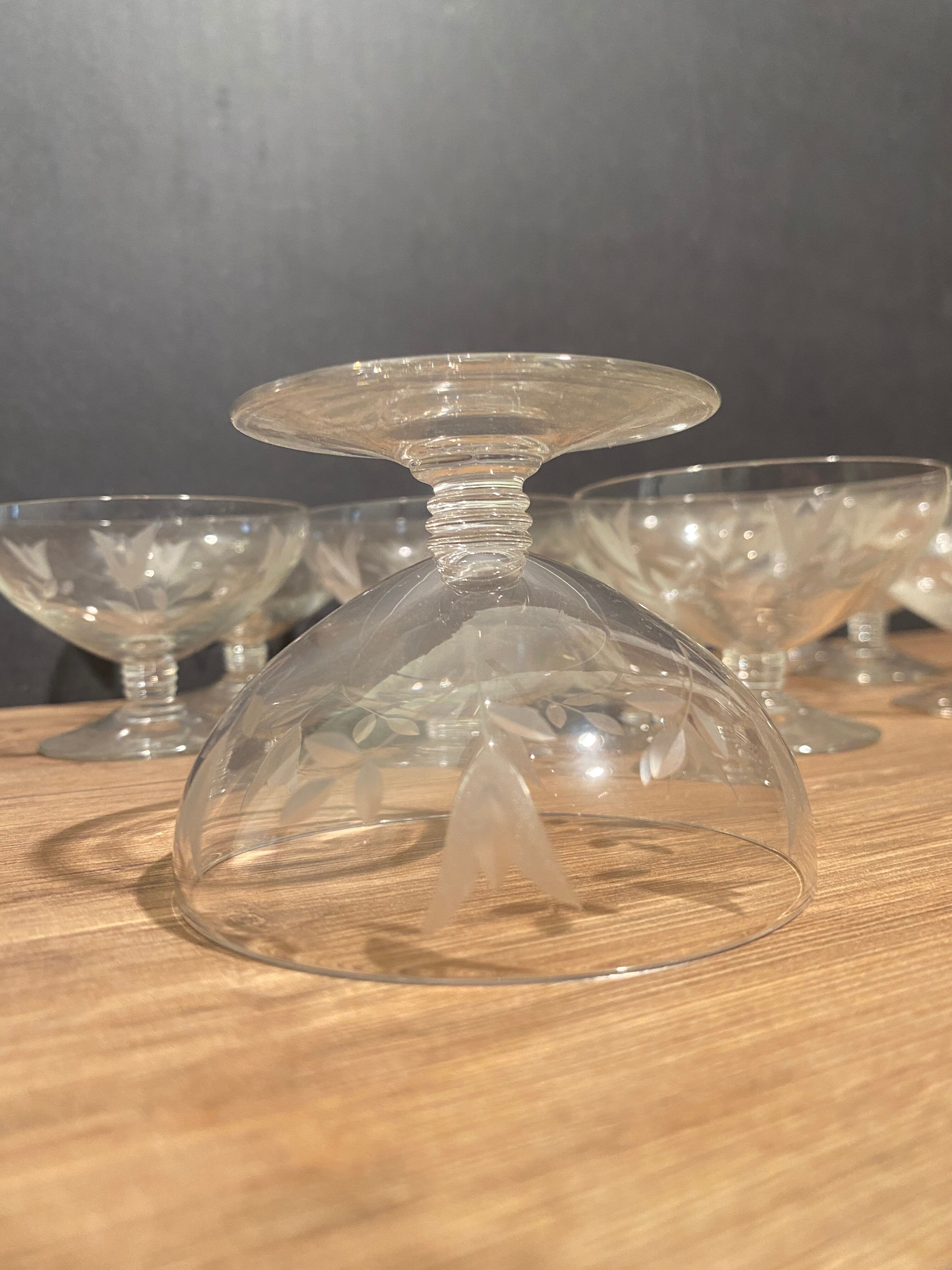 Suite of 12 champagne glasses in cut glass with floral decoration