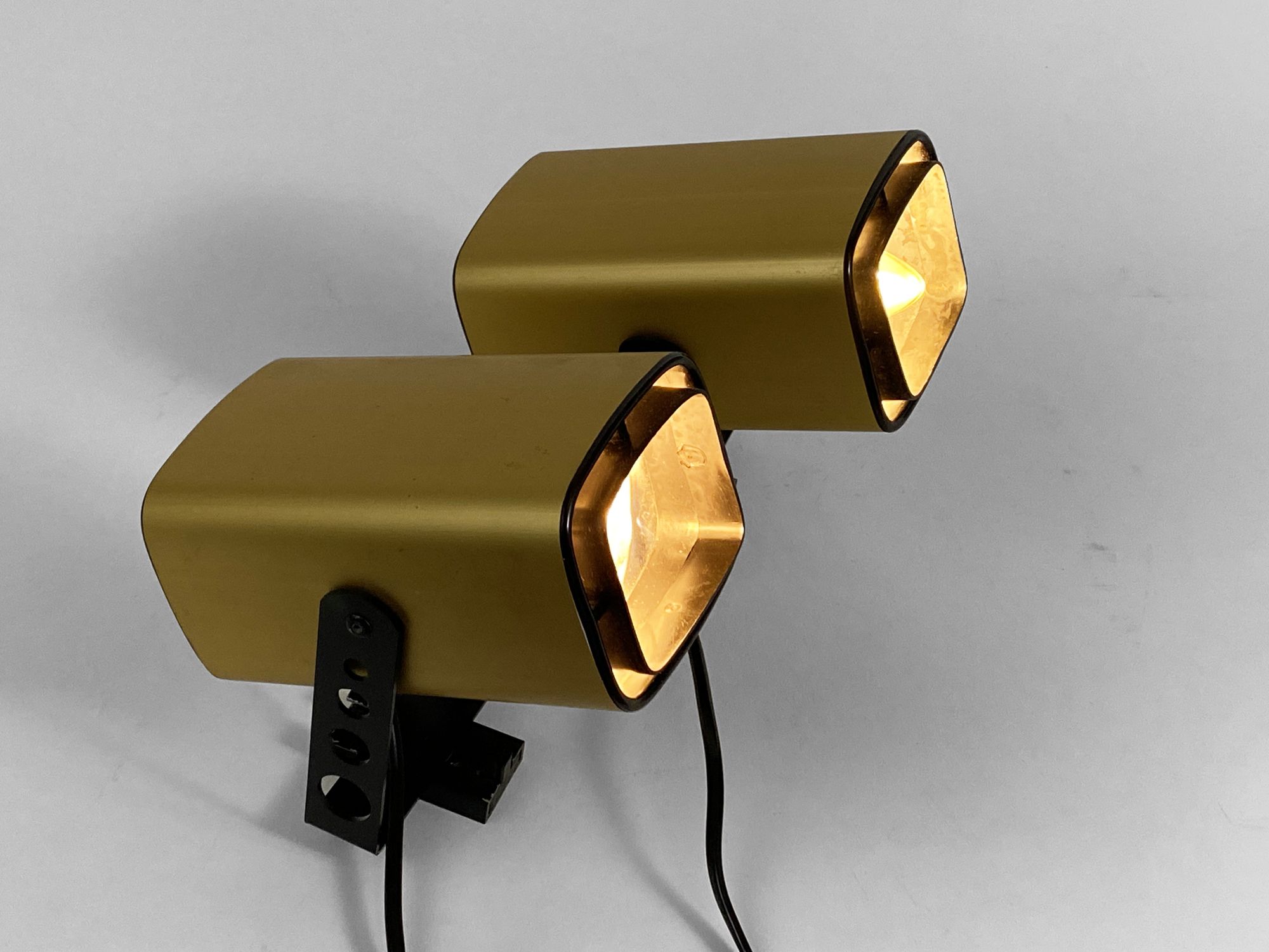 Pair of matte gold bedside wall lamps by Öia. Sweden 1970s