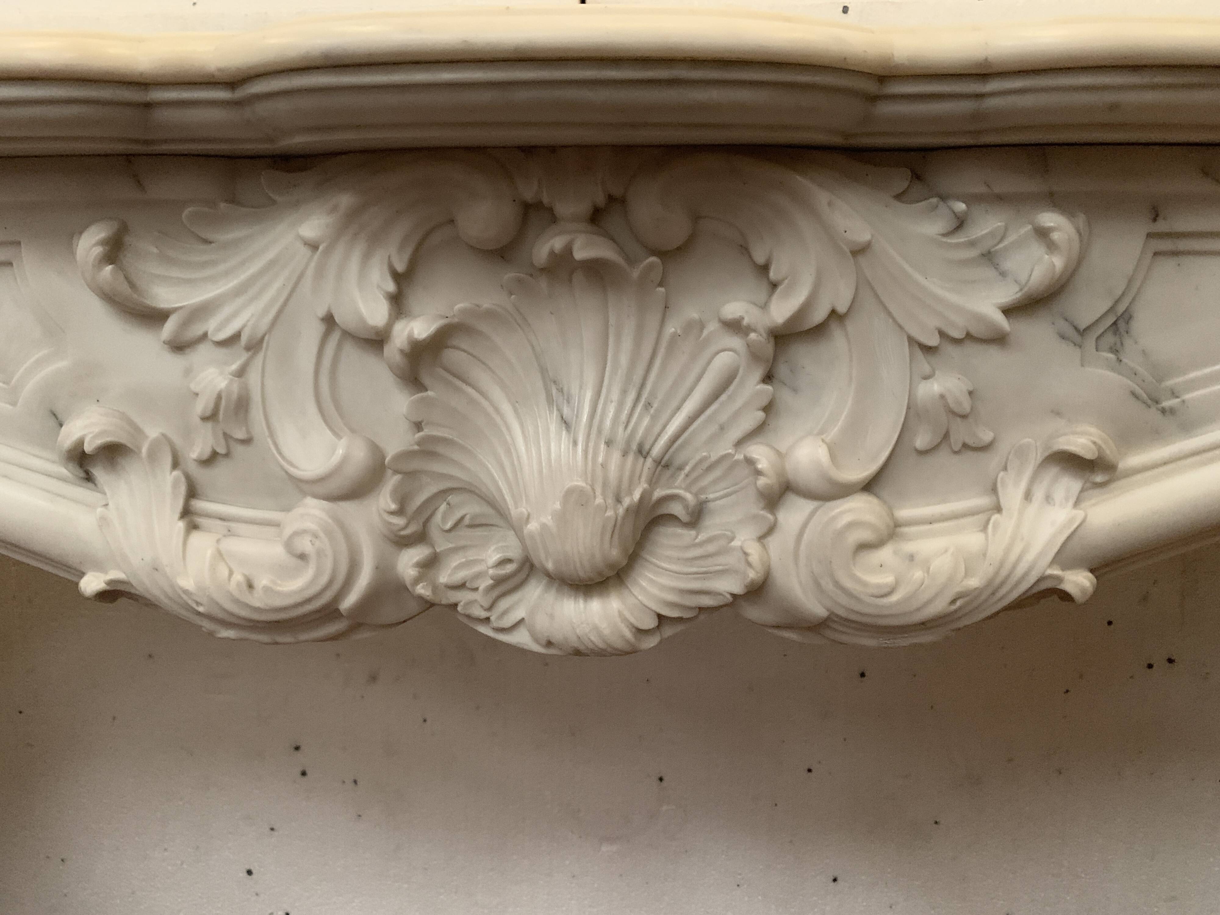 Louis XV style fireplace in white Carrara marble, 19th century