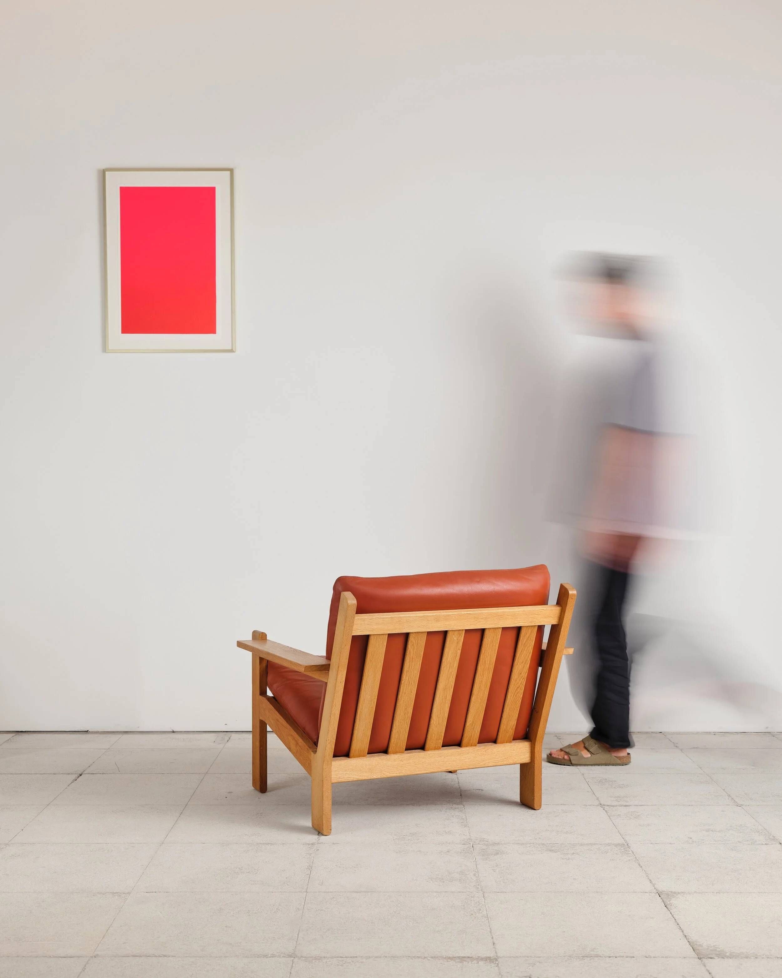 Brutalist armchair in oak and leather by Tage Poulsen, Denmark, 1970s.