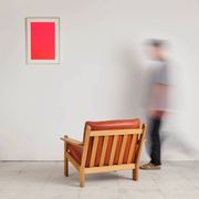 Brutalist armchair in oak and leather by Tage Poulsen, Denmark, 1970s.
