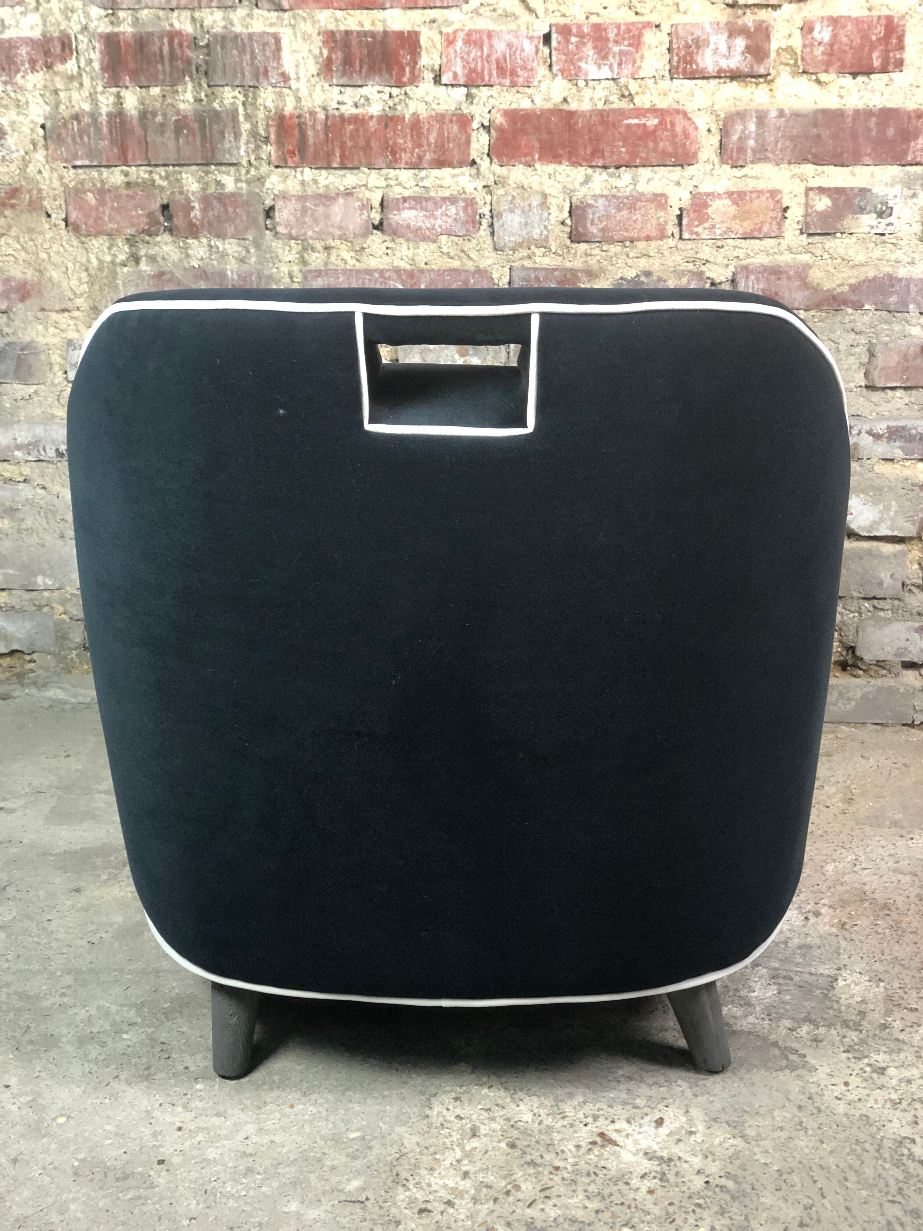 Retro vintage 80's armchair in black velvet with white trim