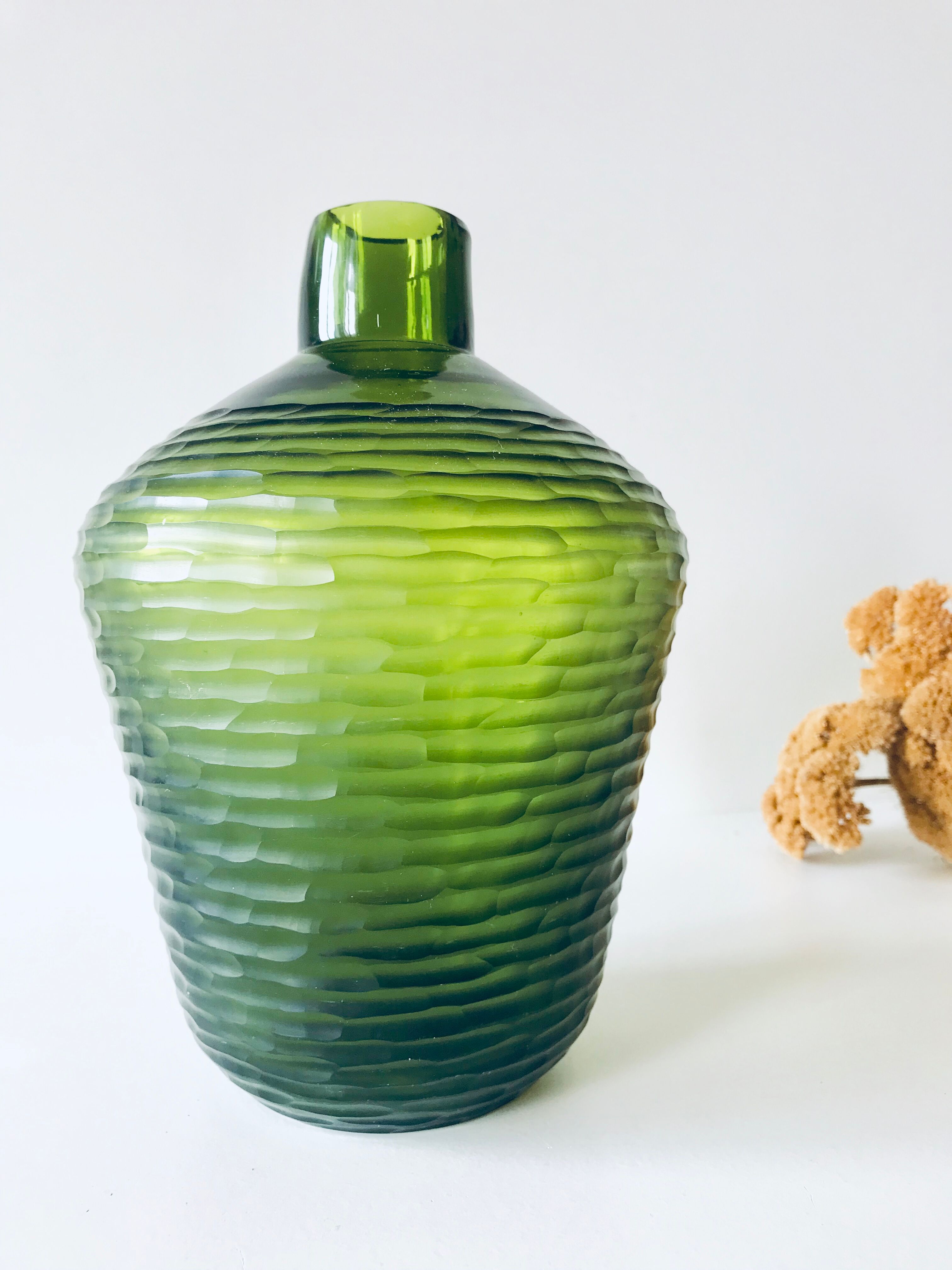 Green carved glass vase