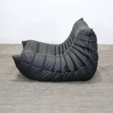 Togo armchair and footrest in black leather by Ligne Roset, designed by Michel Ducaroy.