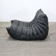 Togo armchair and footrest in black leather by Ligne Roset, designed by Michel Ducaroy.