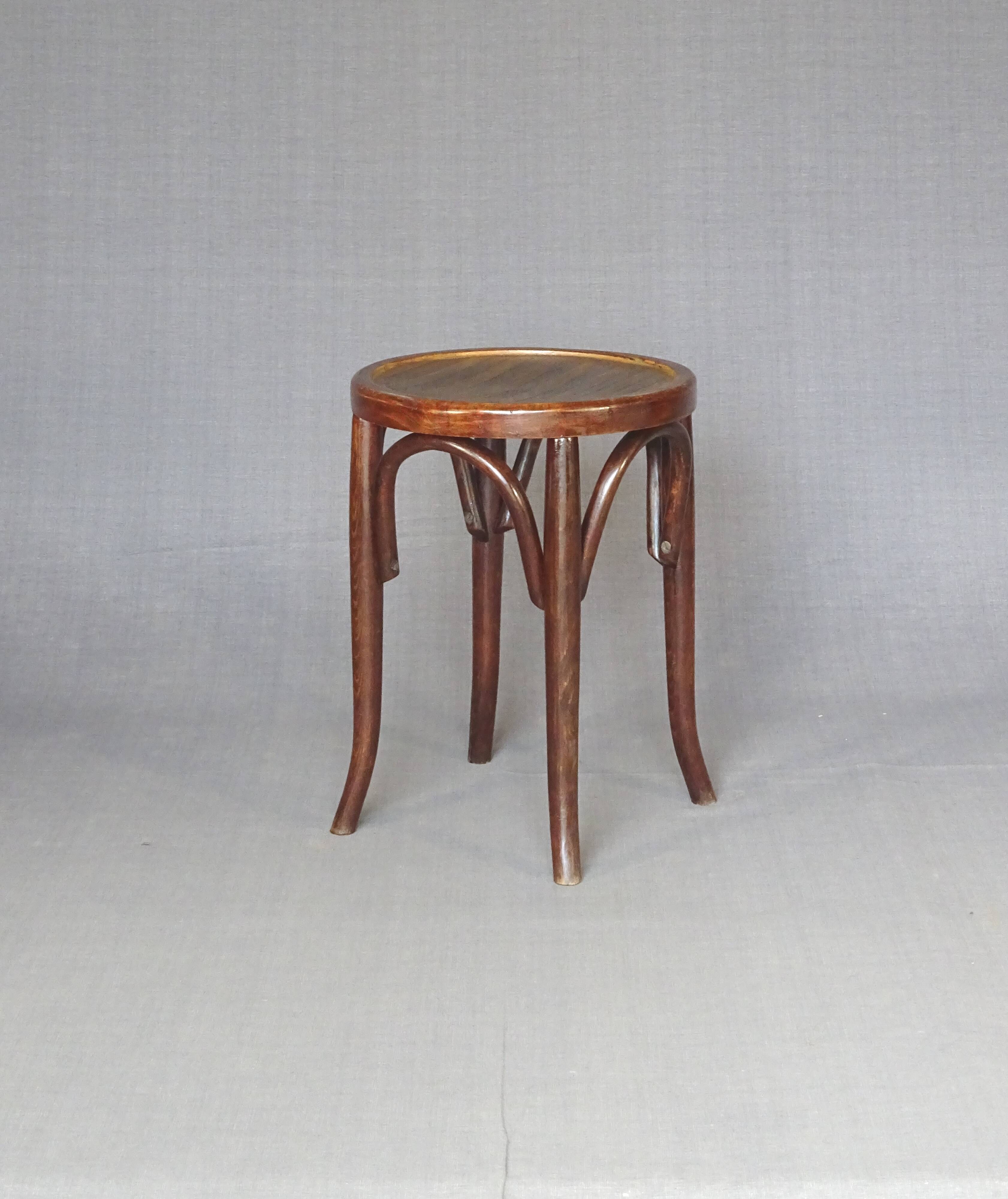 low bistro stool in curved wood laminated seat, circa 1920