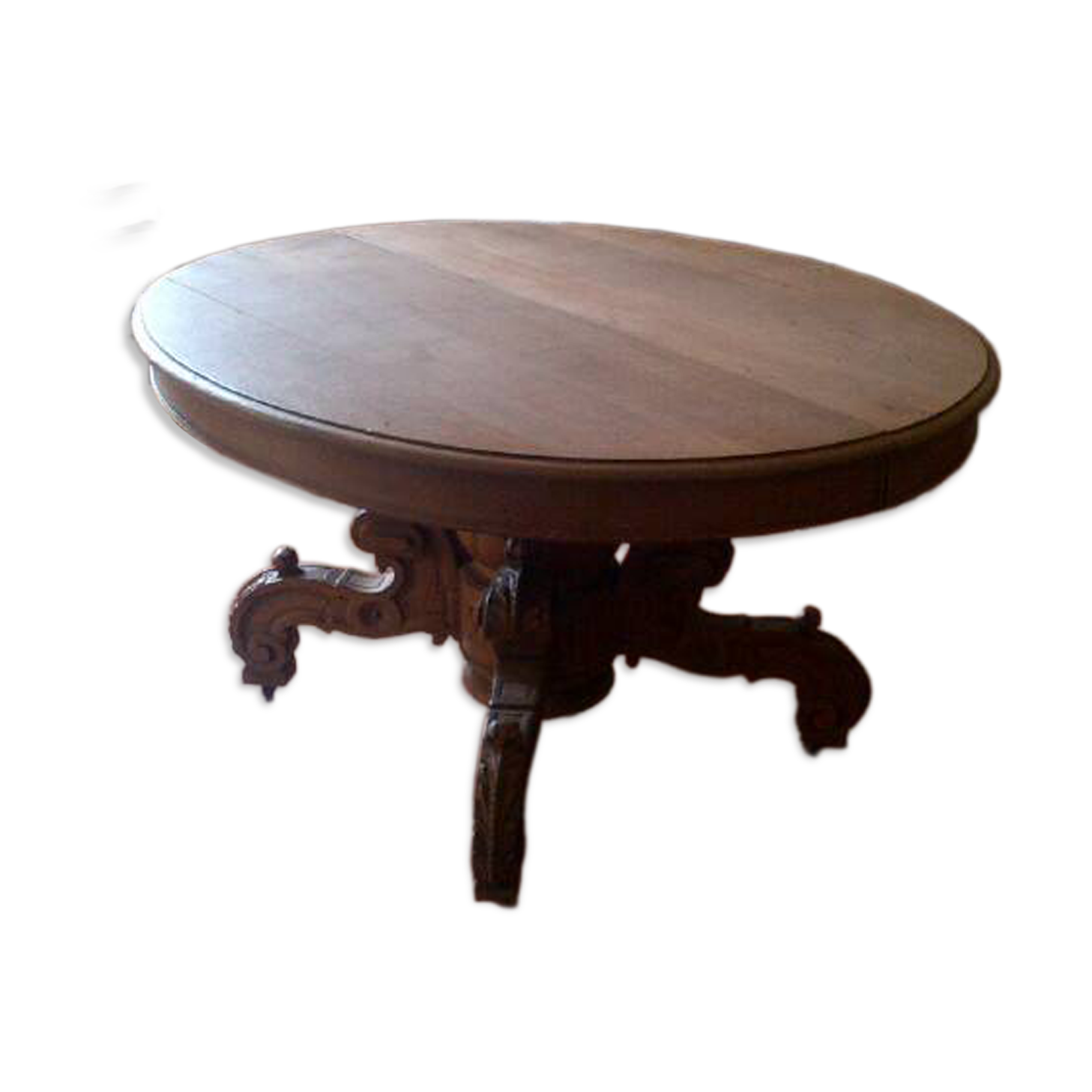 Large antique table in solid oak with a superb carved base.