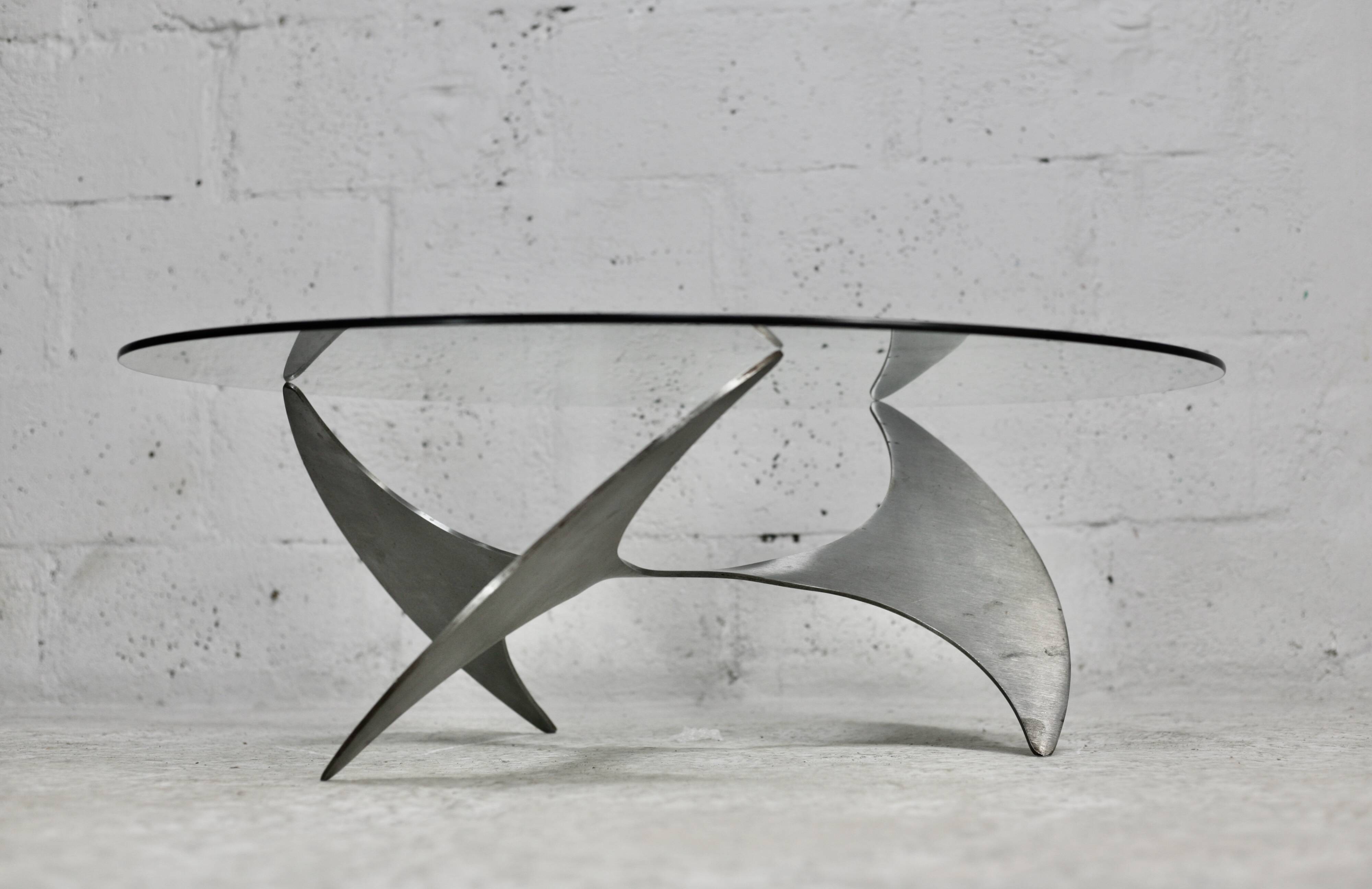 "space age" coffee table. Steel legs, glass slab. Circa 1970