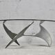 "space age" coffee table. Steel legs, glass slab. Circa 1970