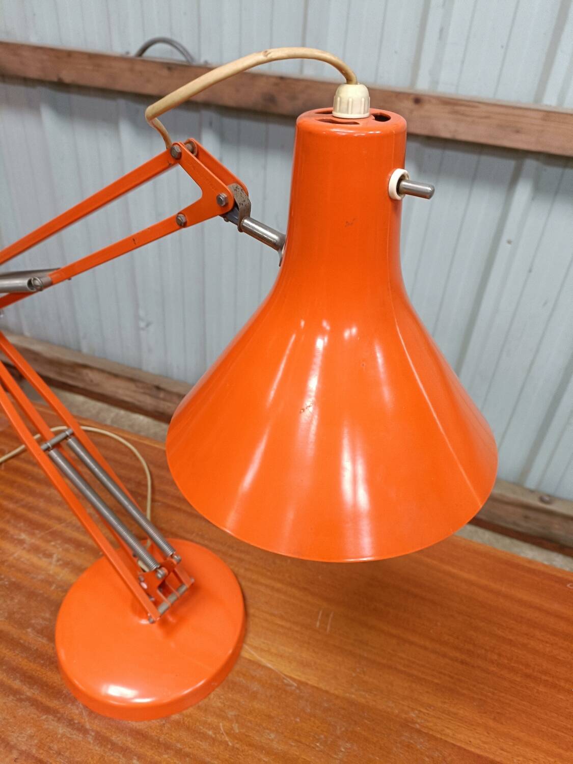 Luxo L4 vintage orange lamp with foot