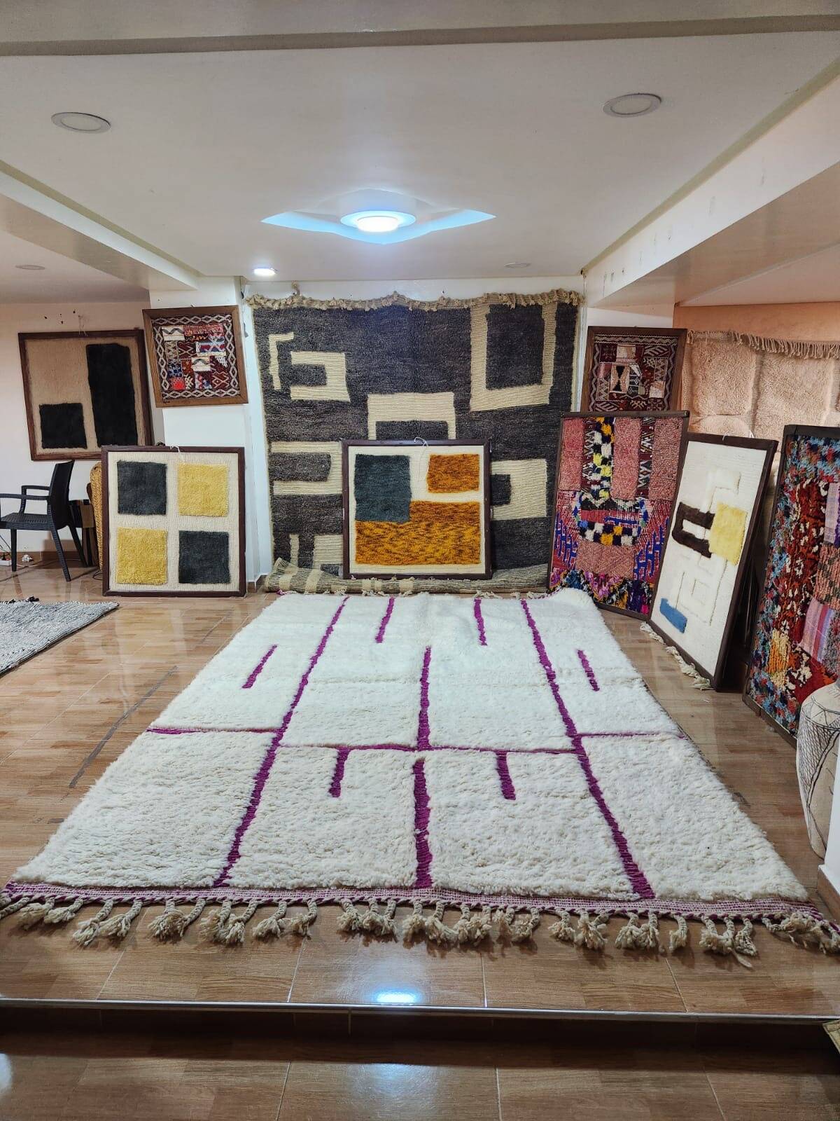 Moroccan Berber rug, cream wool with purple graphic patterns, 300x200 cm.