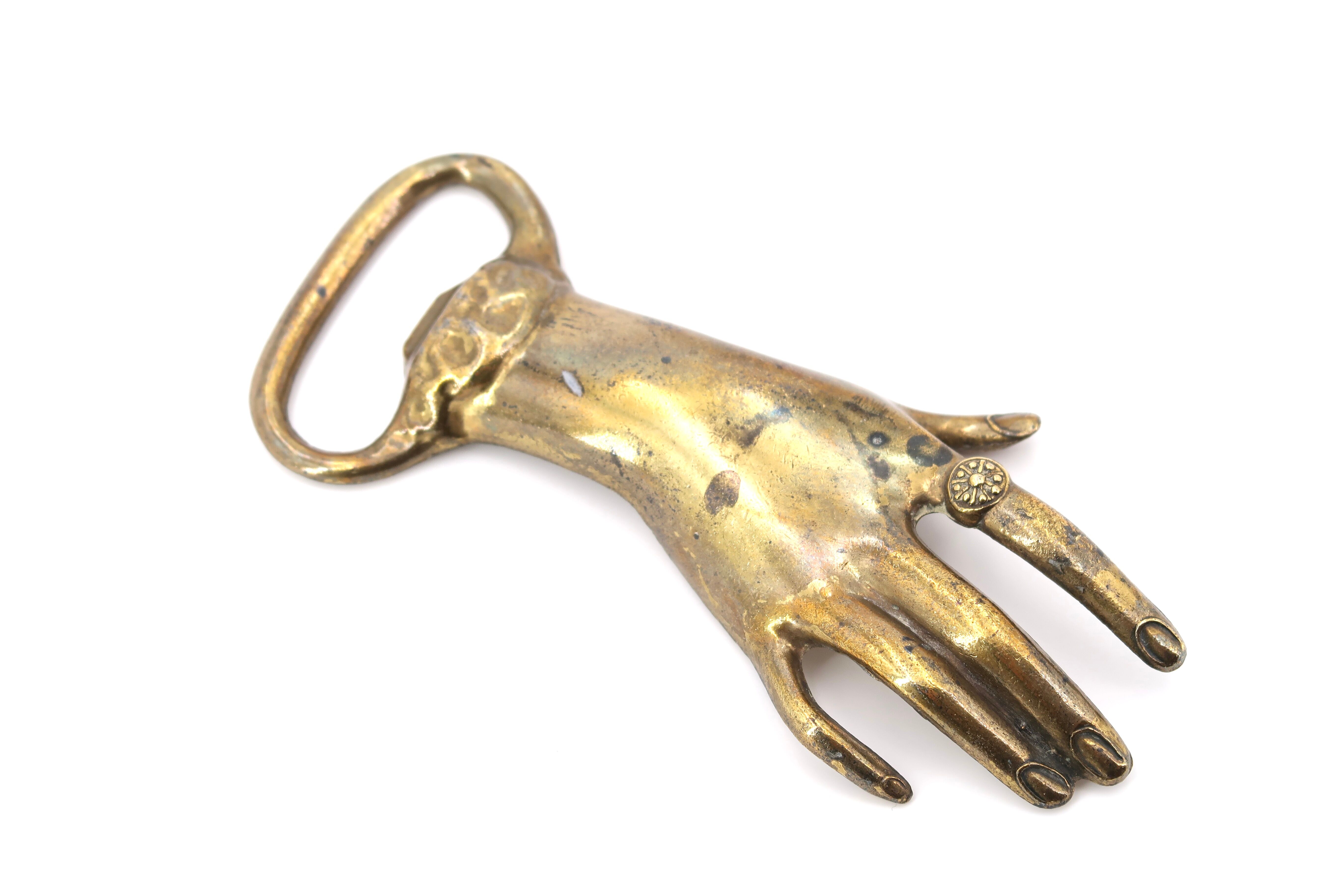Brass hand bottle opener, 50s