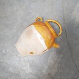 Old gargoulette pot in glazed terracotta