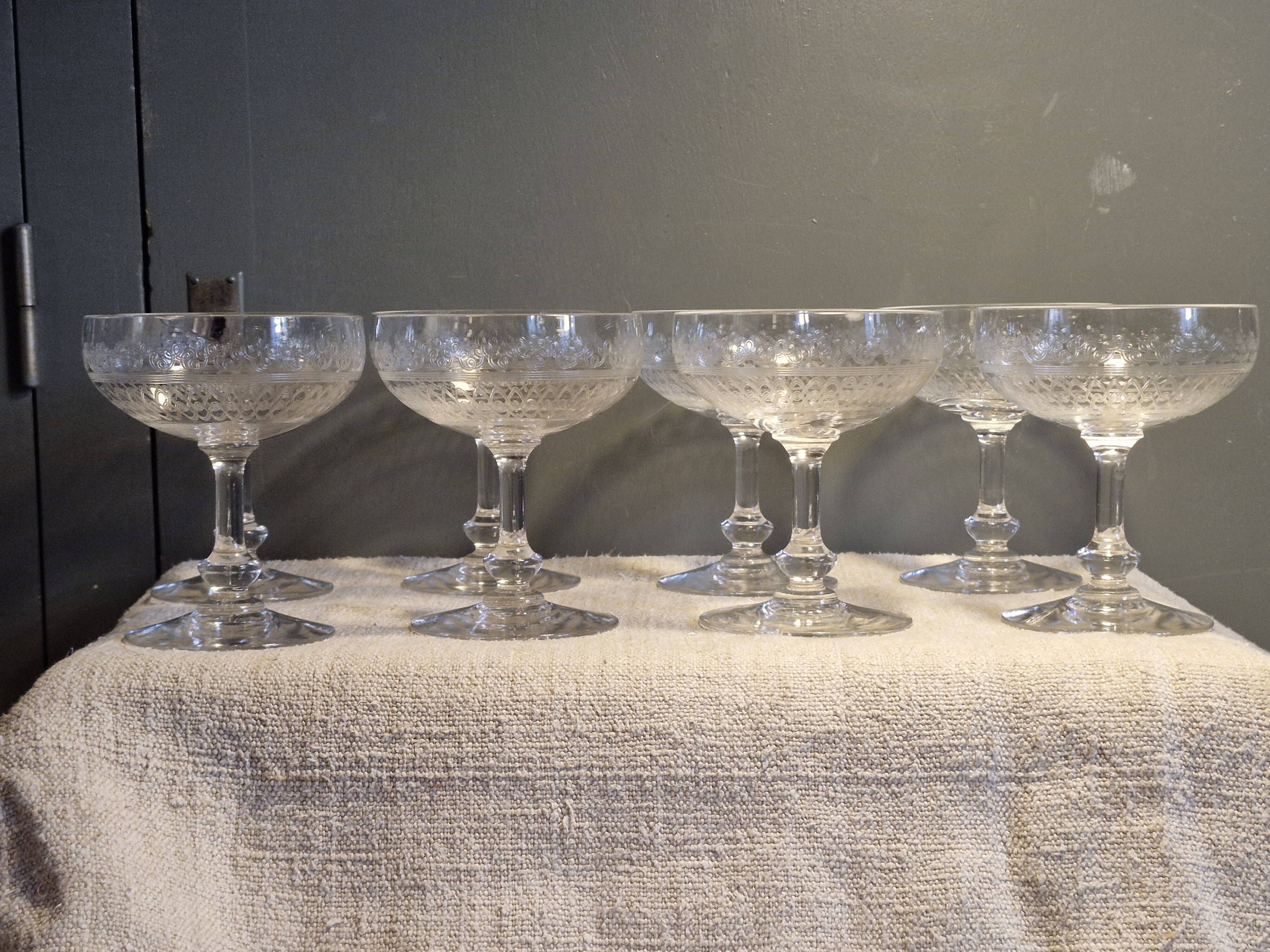 8 antique Baccarat crystal champagne coupes with engraved decoration.
