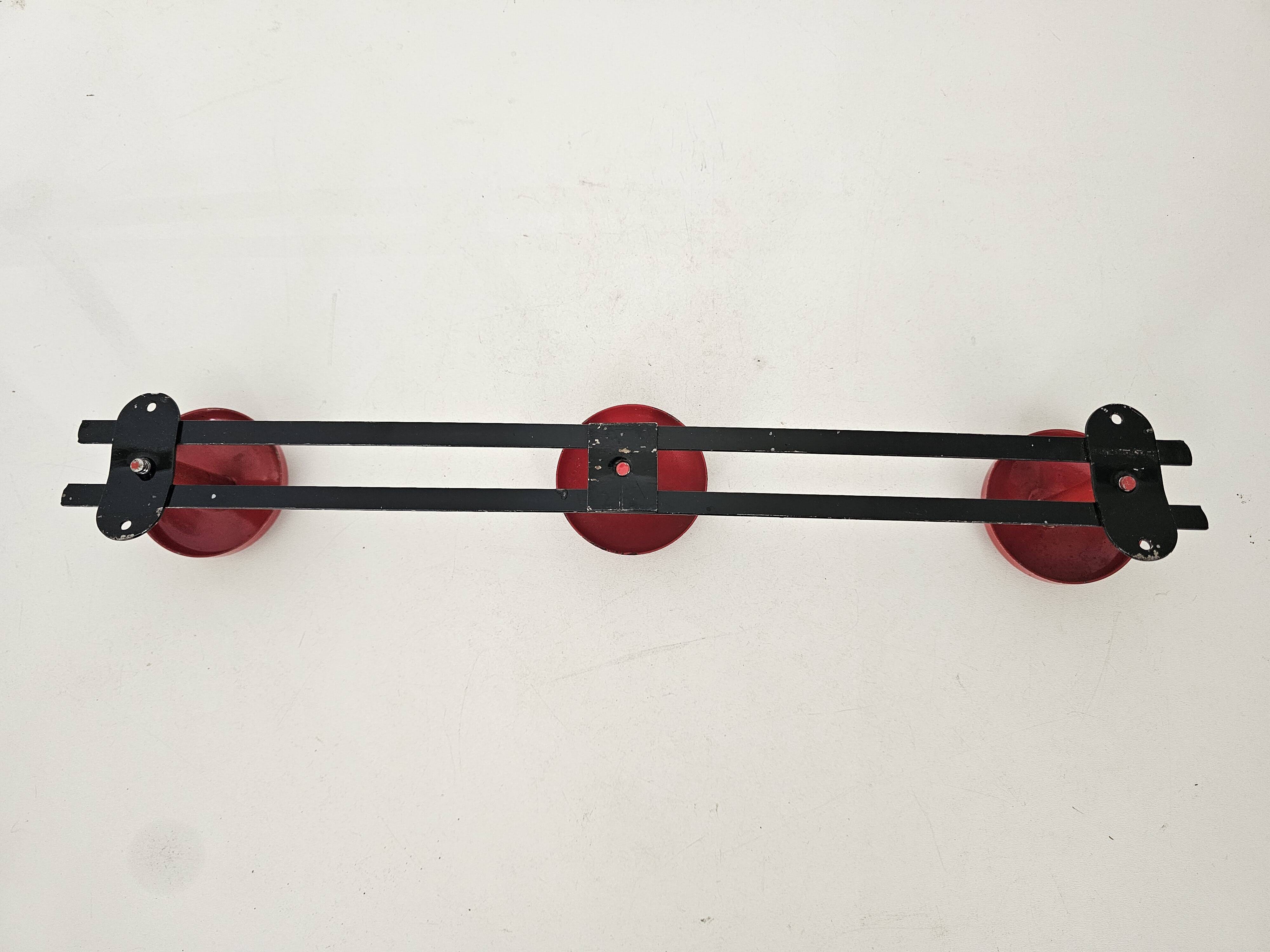 Vintage black and red coat rack with 3 hooks from the 1960s.