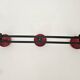 Vintage black and red coat rack with 3 hooks from the 1960s.