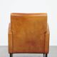 Characteristic sheepskin design armchair in beautiful warm cognac colours