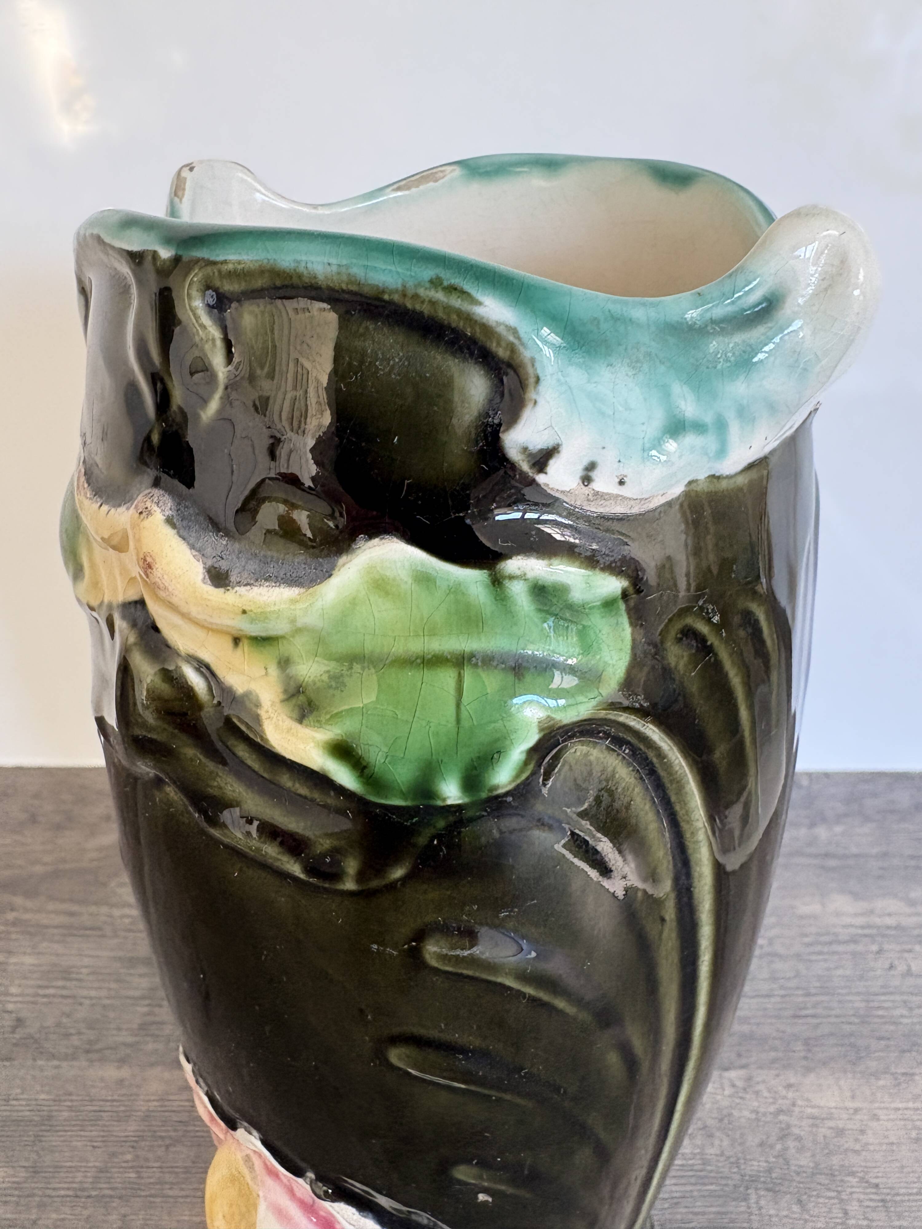 Antique ceramic vase by De Bruyn with floral decoration.