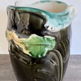 Antique ceramic vase by De Bruyn with floral decoration.