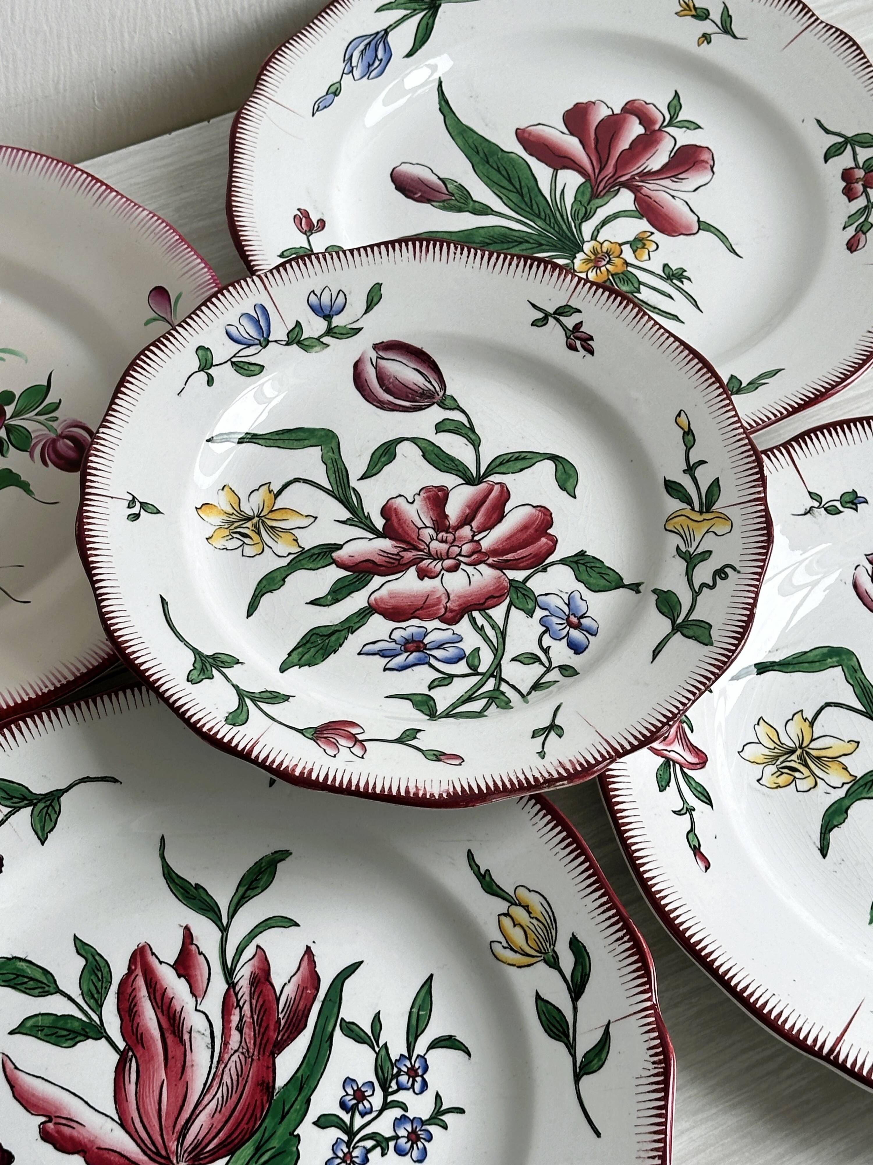 5 plates with colorful Sarreguemines floral designs.