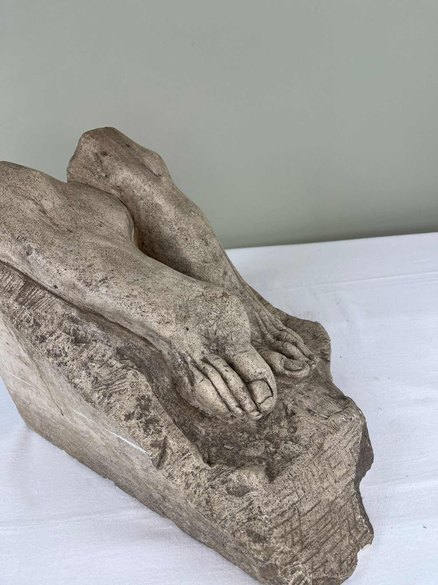 Stone sculpture, two feet on a block, signed D. Paillot.