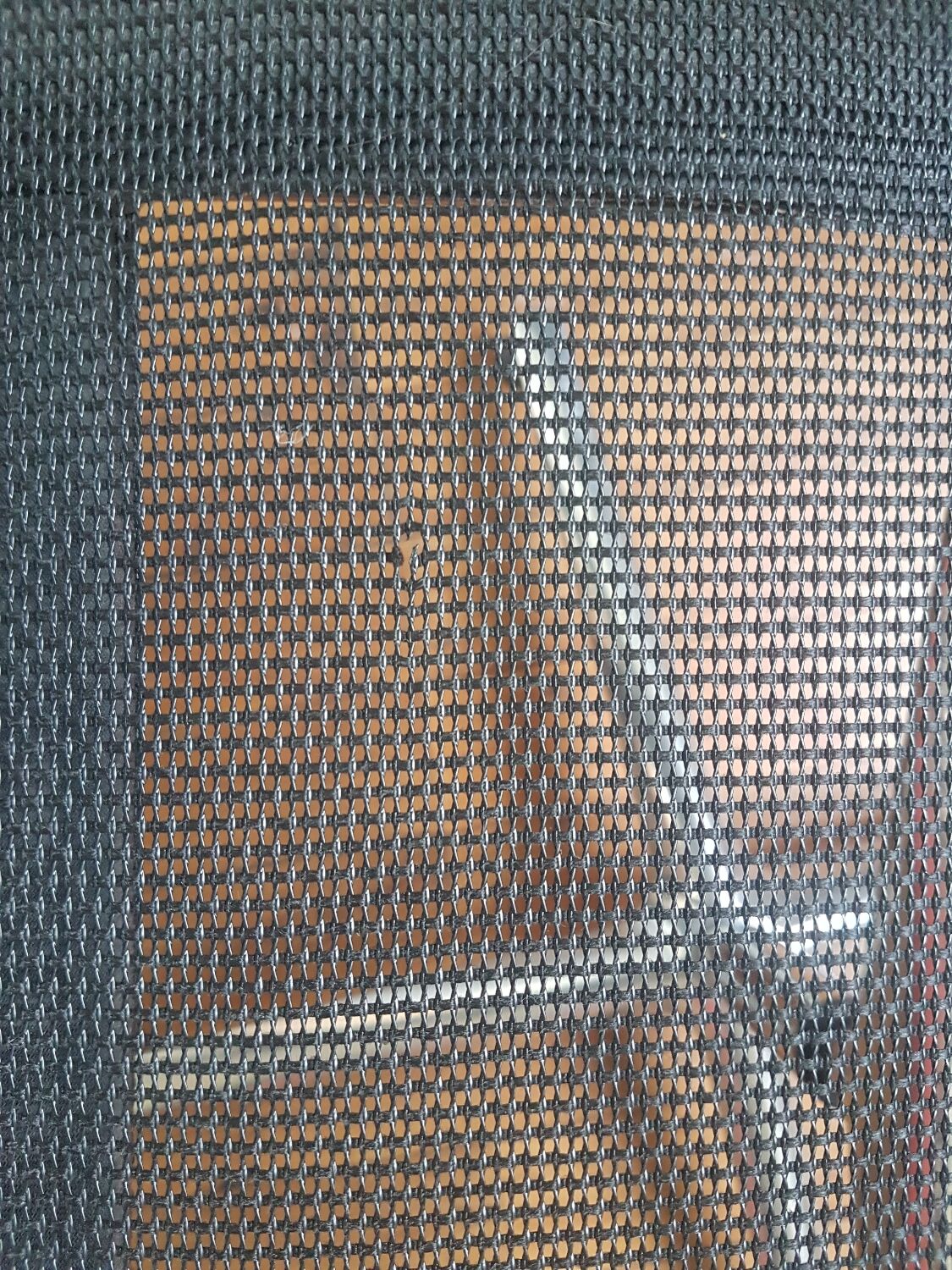 Una Chair armchair in black mesh published by ICF